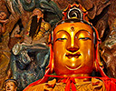 Golden and colorful Buddas at the Jade Buddha Temple in Shanghai, China